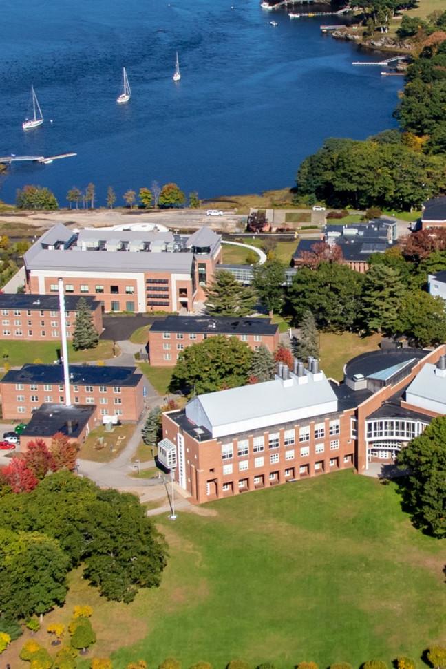 Aerial picture of U N E's Biddeford campus including the ocean and buildings